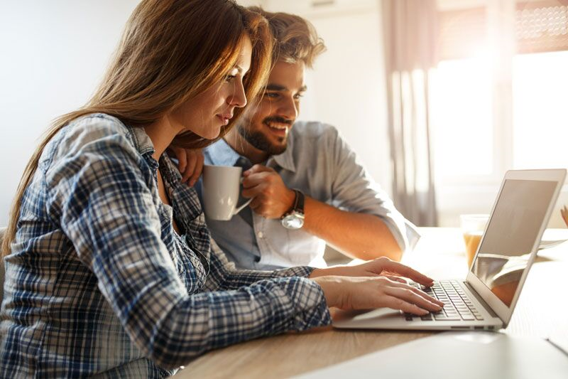 young couple on laptop