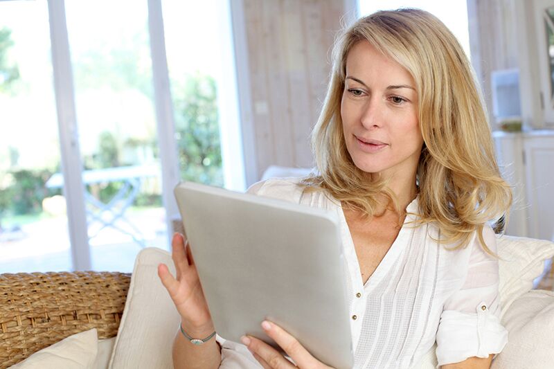 lady reviewing life insurance policy on tablet