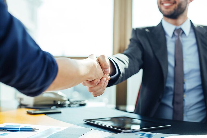 shaking hands after business promotion