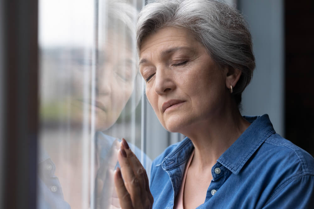 old age woman thinking about life insurance plan